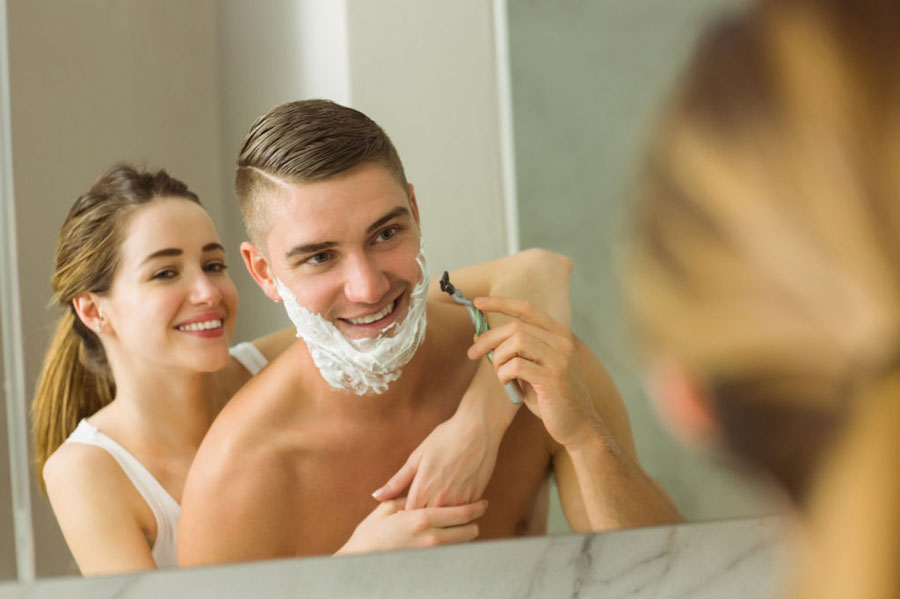 Woman shaving men