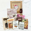 Mother’s Day gift basket featuring Earl Grey tea, sweet treats, savory snacks, and a pink keepsake journal
