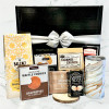 Coffee gift basket featuring Balzac’s coffee, marble mug, chocolate treats, biscotti, and snack assortment