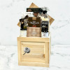 Sympathy gift basket featuring truffles, dark chocolate, caramel corn, and comforting snacks