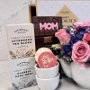 Mother’s Day tea gift basket with floral teapot, teacups, gourmet cookies, chocolates, and premium tea selection