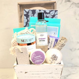 Lavender Spa Basket with bath essentials, lavender body care, facial masks, tea, and relaxation accessories