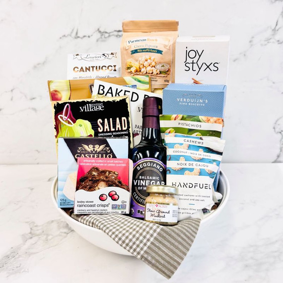 savory gift basket in glass bowl with crackers, nuts, popcorn, and artisan food items toronto