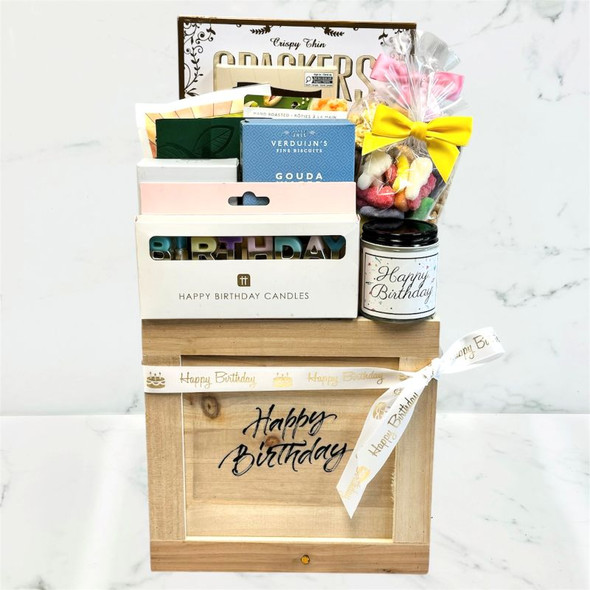 Birthday Bliss Crate with gourmet snacks, tea, caramel corn, crackers, pistachios, journal, and birthday candles