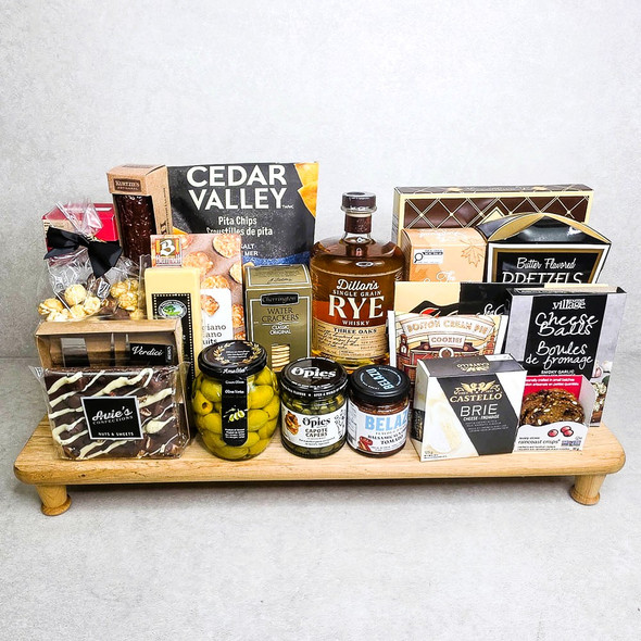 Special Celebration Gourmet Food Basket with gourmet cheeses, smoked salmon, crackers and sweets on a standing serving board.