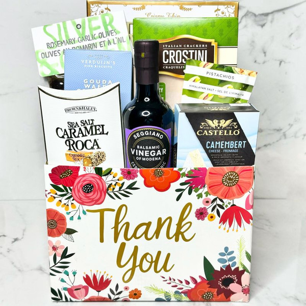 thank you gift box with cheese, crackers, olives, pistachios, and premium food items
