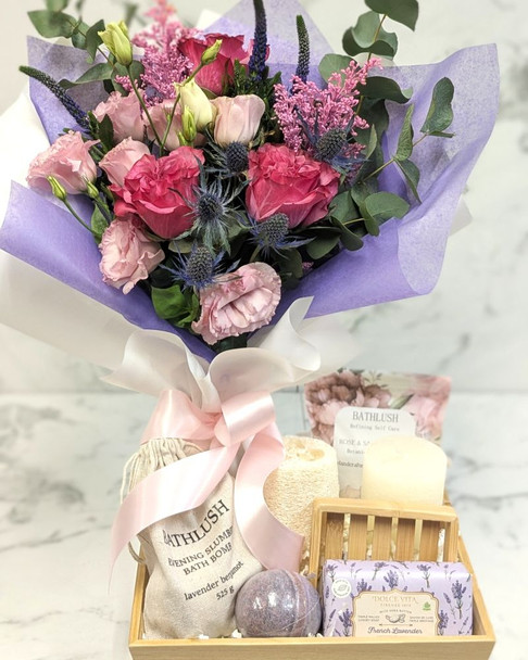 Blush & Bloom Spa Gift Set combining colorful floral bouquet and curated spa gift box for relaxation and pampering