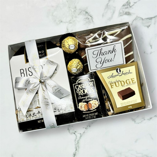 Close-up of admin appreciation gift box with assorted gourmet sweets and chocolate treats