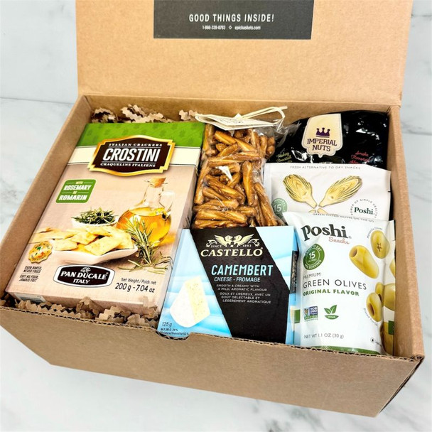 Close-up of appreciation gift box with cheese, crackers, marinated artichokes, olives, and mixed nuts