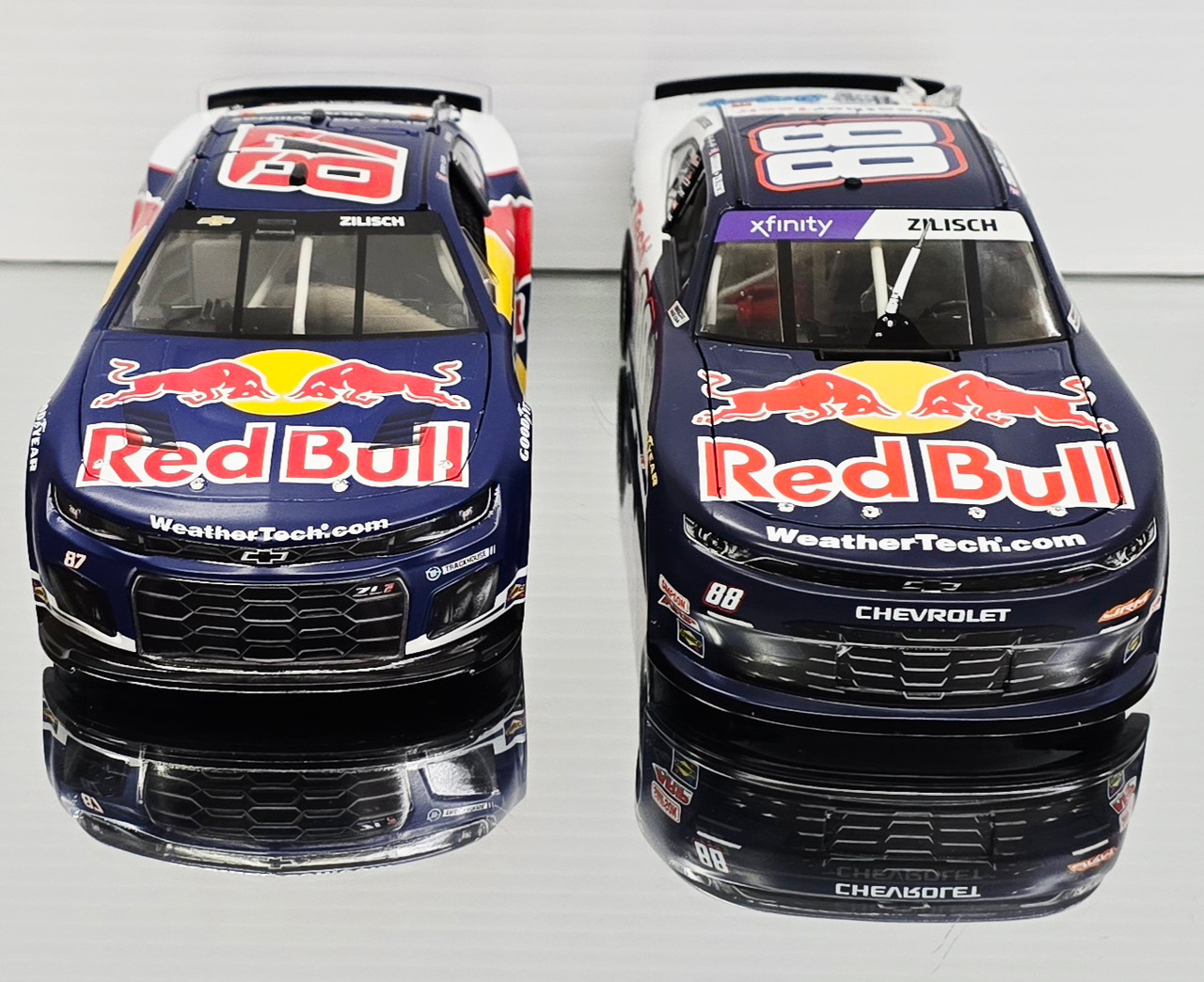 SVG & CONNOR ZILISCH 2025 WEATHERTECH/ RED BULL COMBO 1/24 ACTION DIECASTS