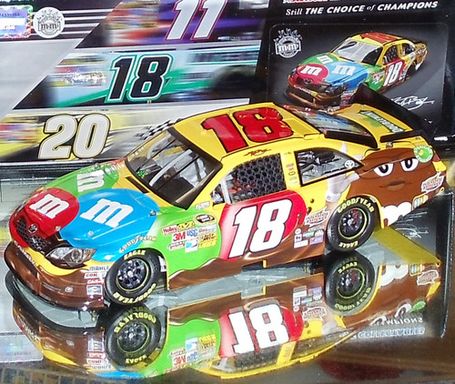 KYLE BUSCH 2015 CHAMPIONSHIP M&M'S 1/24 ACTION (EXCLUDED FROM COUPONS)