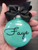 aqua glitter name Christmas ornament hanging on tree