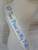 white sash with blue font