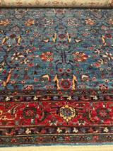 Medium blue background living room size rug 8'1 X 9'9