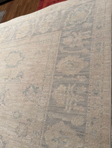 Subtle light colorful room-sized hand-knotted rug made in Pakistan 7'11"x10'