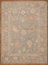 Pakistani hand-knotted featuring a floral design with faded colors 5'1"x6'11"