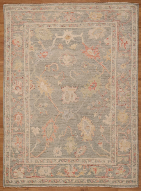 Pakistani hand-knotted featuring a floral design with faded colors 5'1"x6'11"