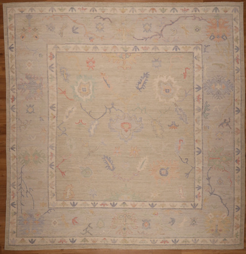 Faded Pakistani hand-knotted carpet with colorful floral design 9'11"x10’4”