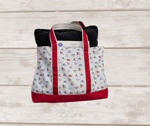Weekender canvas tote with red trim and skiing dogs, made from recycled polyester. About 23.5" wide X 13.5" tall.