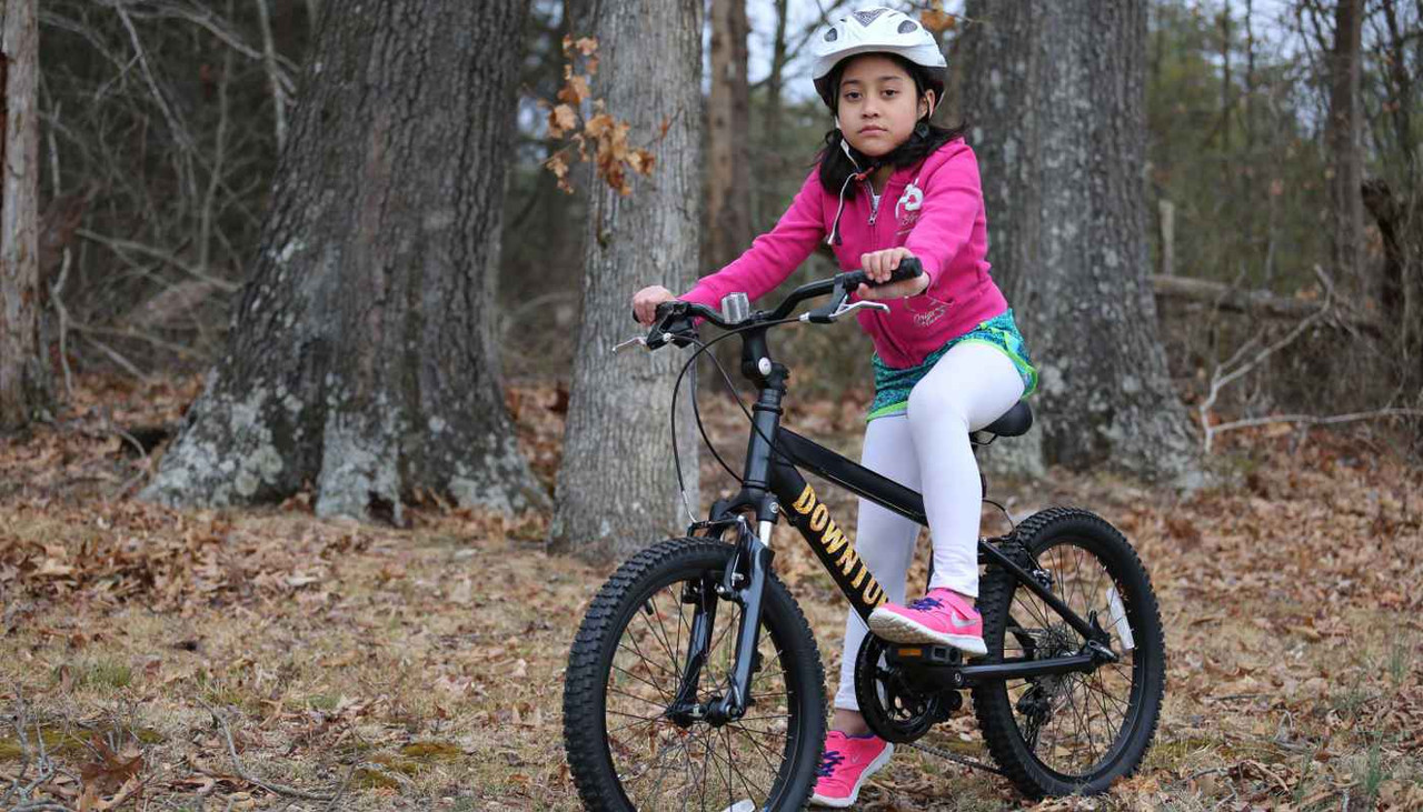 Race kids mountain bike with girl