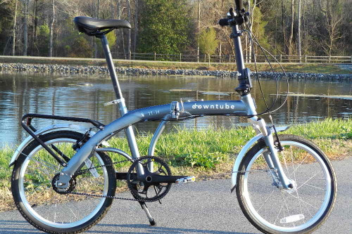 11H folding bike standing in a park