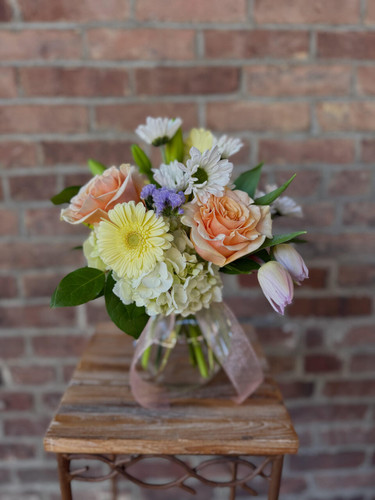 Send mom a beautiful spring mix with hydrangea, roses, gerbers, daisies, and mixed greens. Colors may vary.
