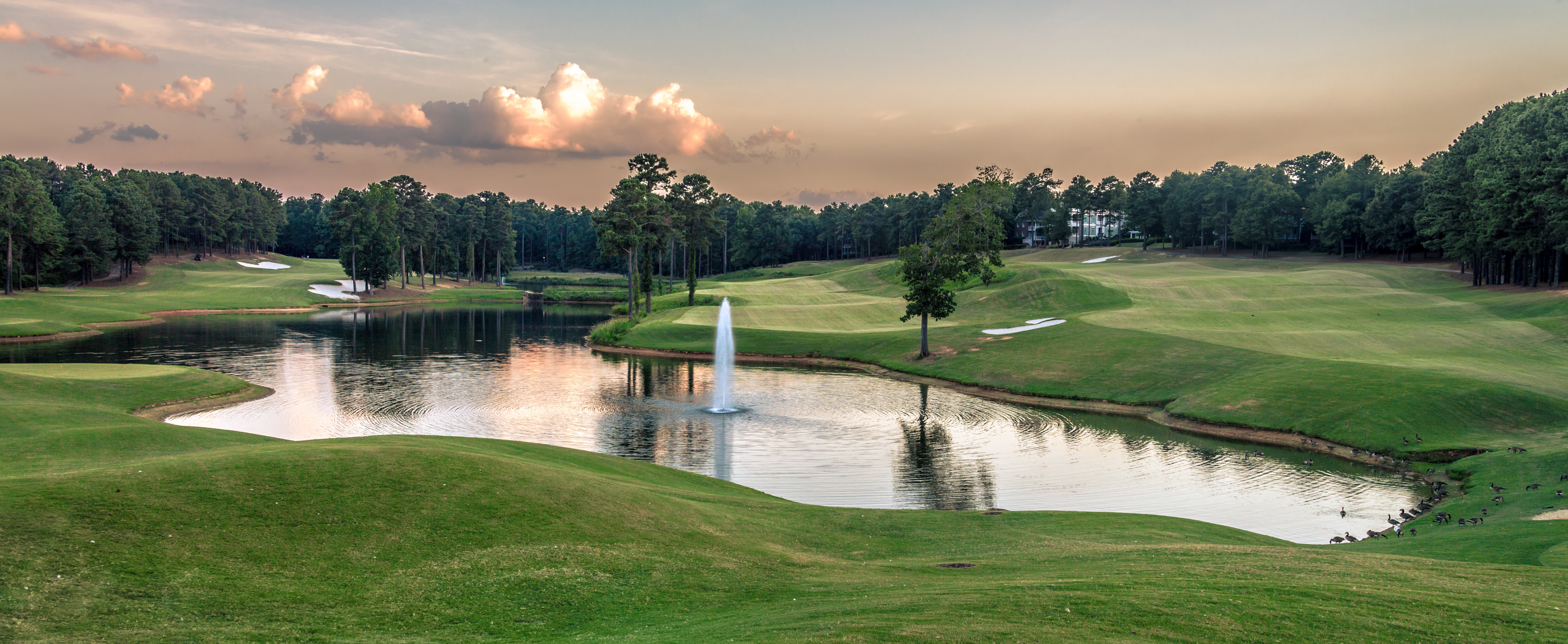 pond pro atlas floating fountain in a golf course pond