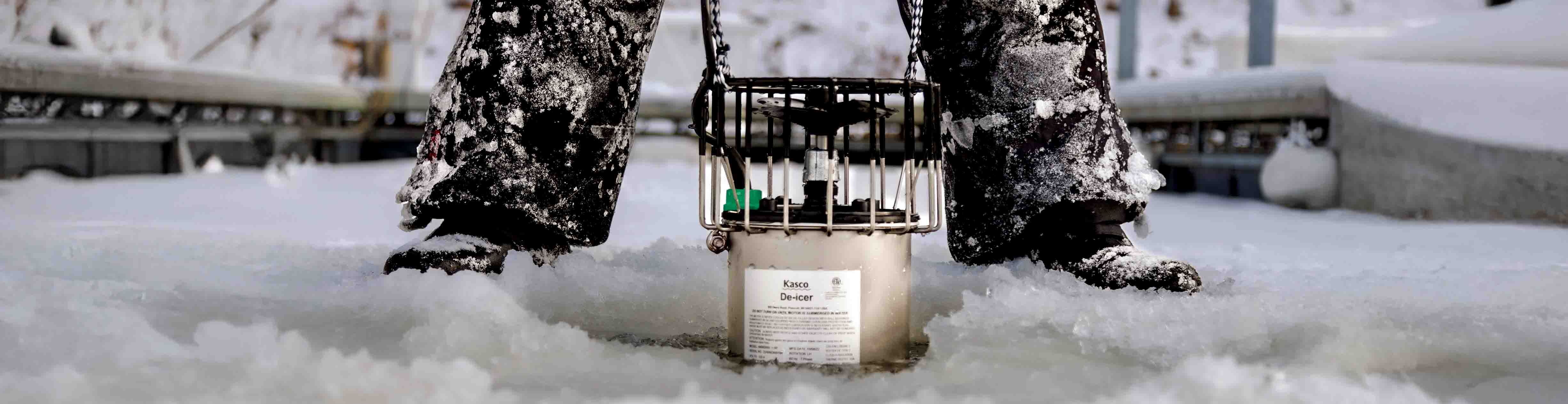 Kasco de-icer being pulled from a snow-covered boat marina in Canada