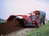 Compost cover roller mounted on turner