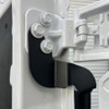 Close-up of Surco TF300 black tire carrier mounting detail on Ford Transit upper driver-side rear door hinge