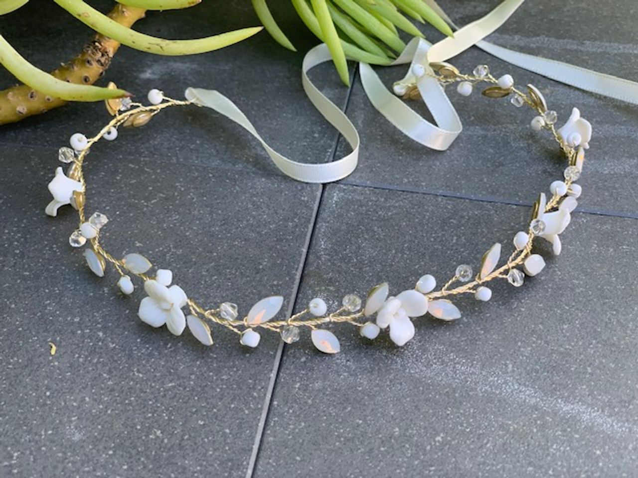 Erica Koesler  A-5704 - Delicate vine of opal stones
