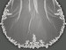 Lucky Collections ™ V M3089 Soft flowered lace centered with rhinestones.