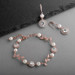 Ivory Pearl and Cubic Zirconia Bridal Bracelet and Earrings Set in Rose Gold
4589BS-I-RG