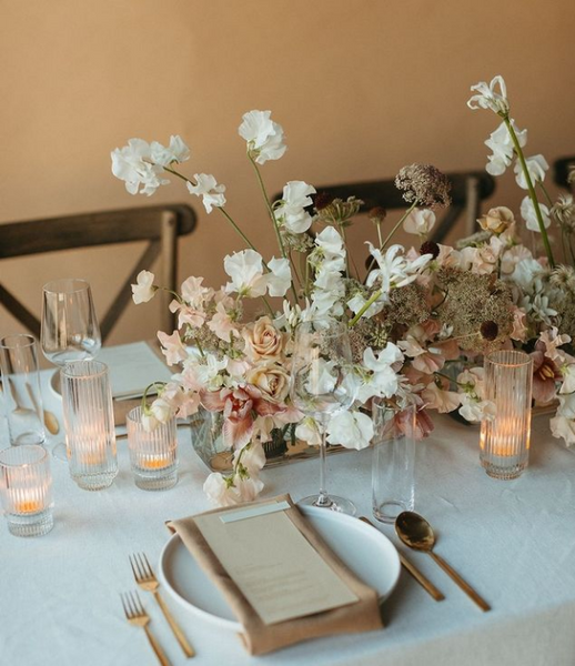 Table Insp: Eggshell colored table with sweet pea and candlelight