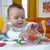 Foetsrgopb Bounce Bounce Baby 2-in-1 Activity Jumper & Table - Playful Palms