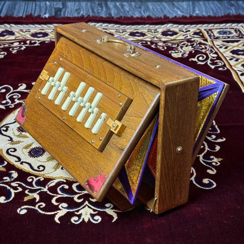 brown teak wood shruti box standing straight on its stand brown teak wood shruti box standing straight on its stand