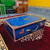 blue-black color shiny harmonium case/box mirroring the surrounding on it's body