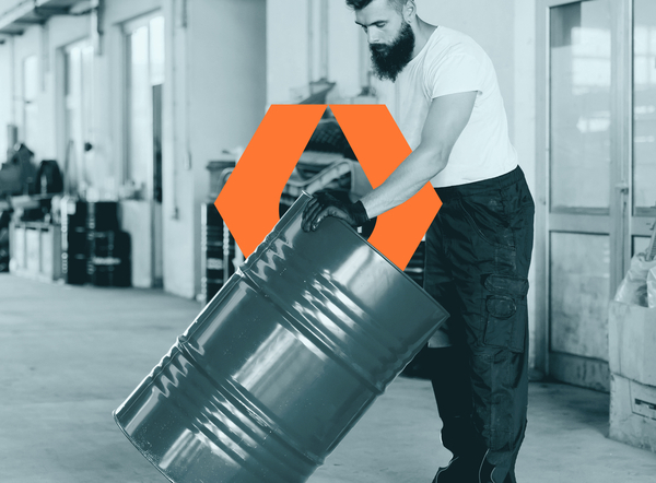 worker carrying drum with motivity icon in background