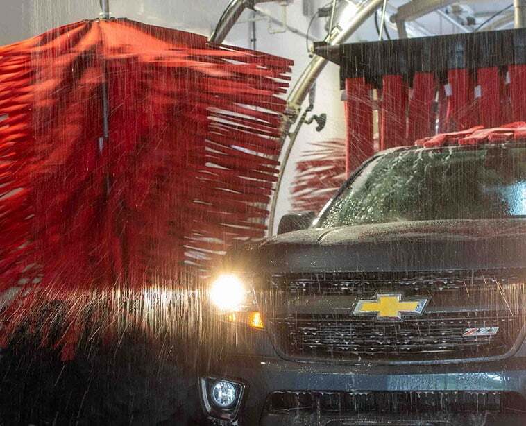 Chevrolet Pickup truck going through automatic car wash