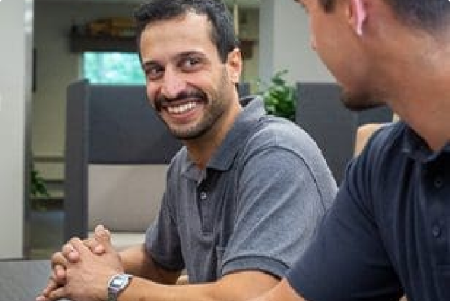 Employees smiling at each other