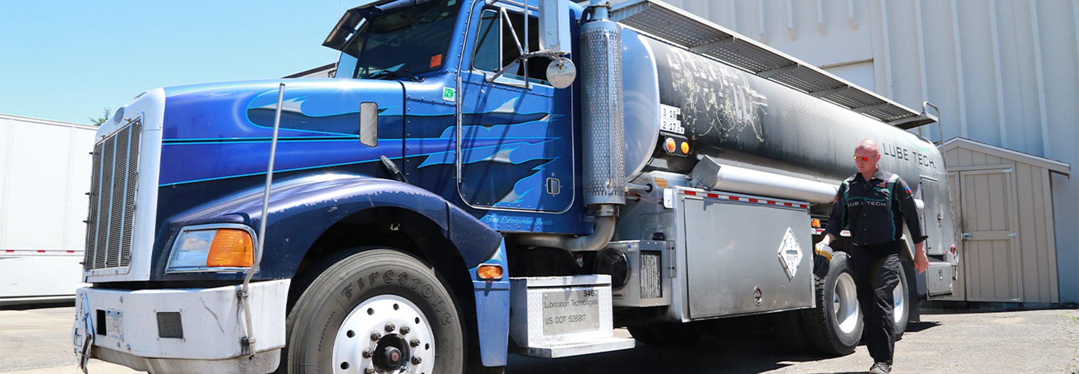 Driver walking by a big truck