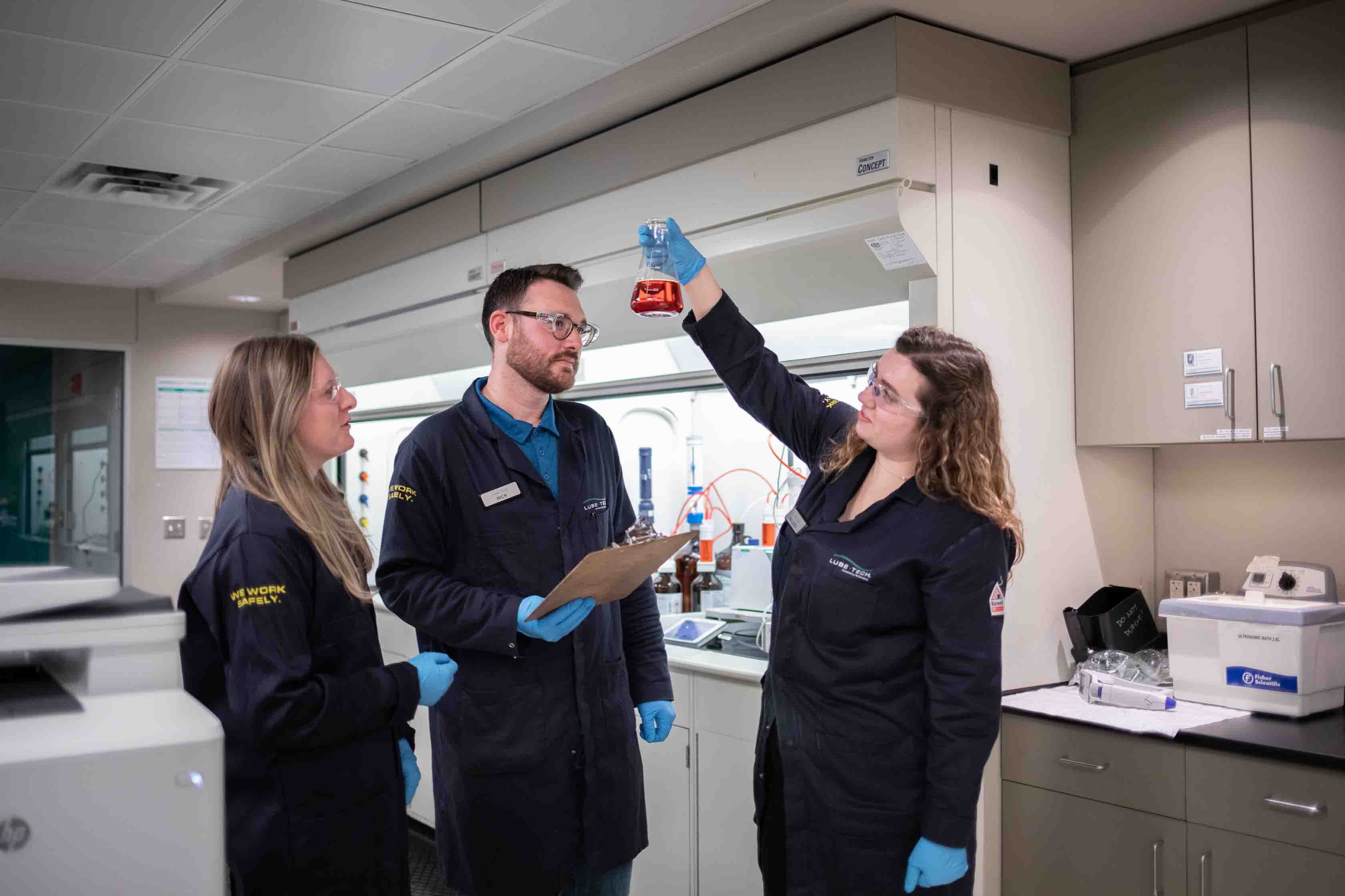 Technicians testing fluid