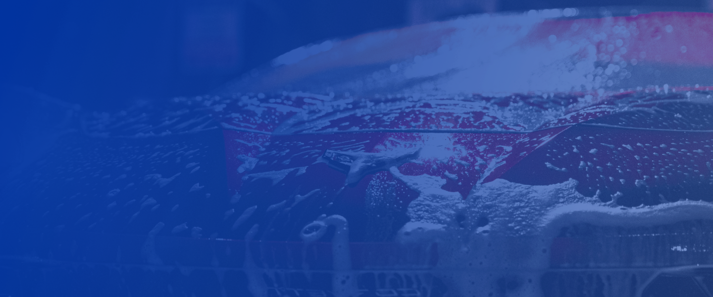 Red car hood covered in soap