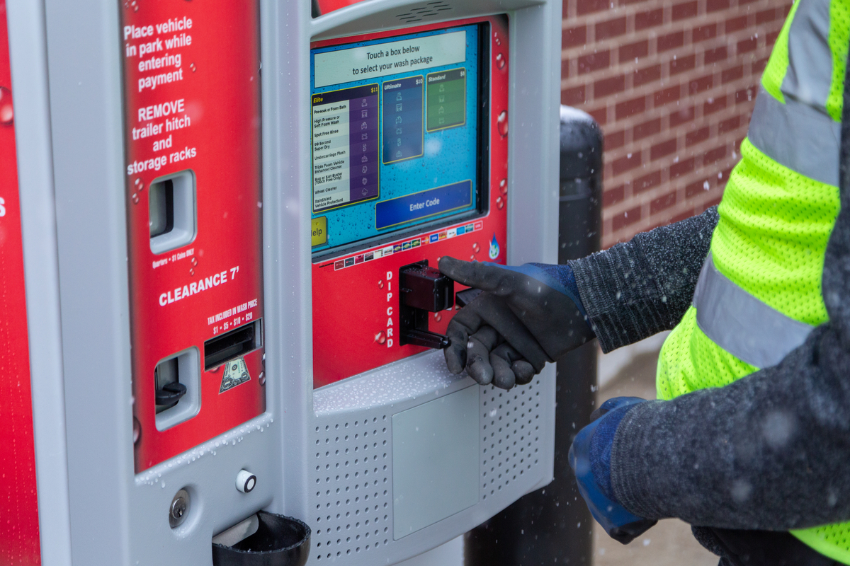 Technician checking equipment settings