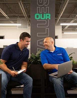 Two lubetech employees collaborating