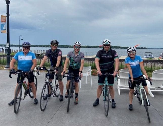 Lubetech employees on bicycles