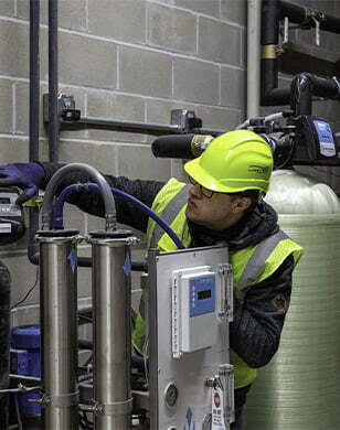 Technician inspecting equipment