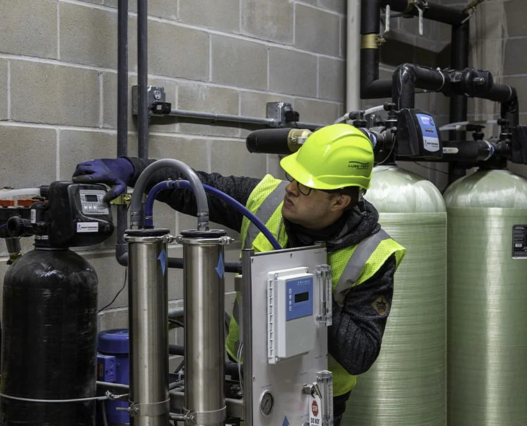 technician inspecting equipment