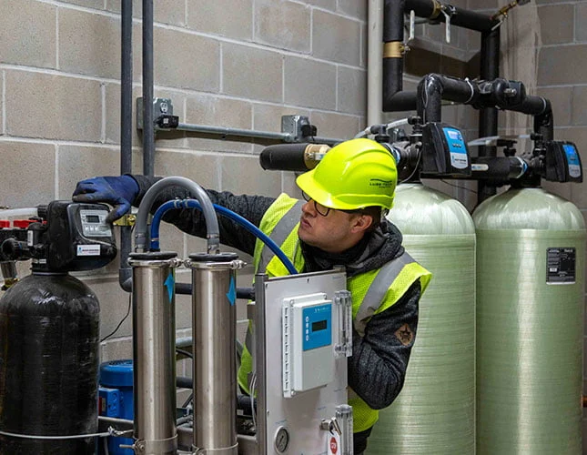 technician inspecting equipment