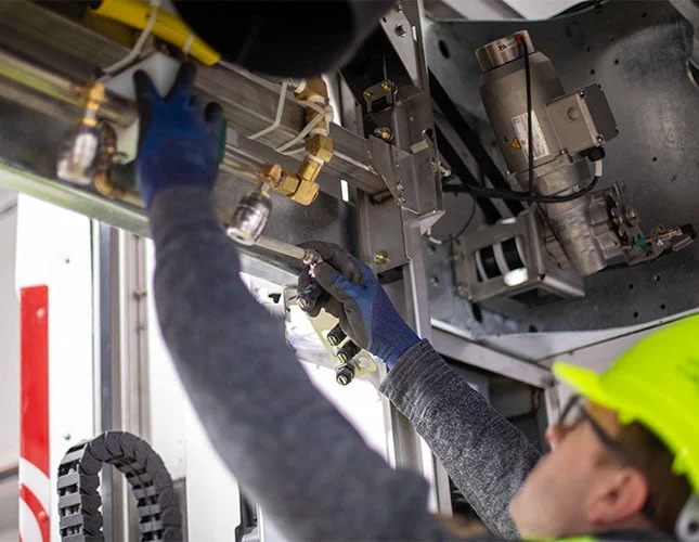 Technician servicing automatic car wash